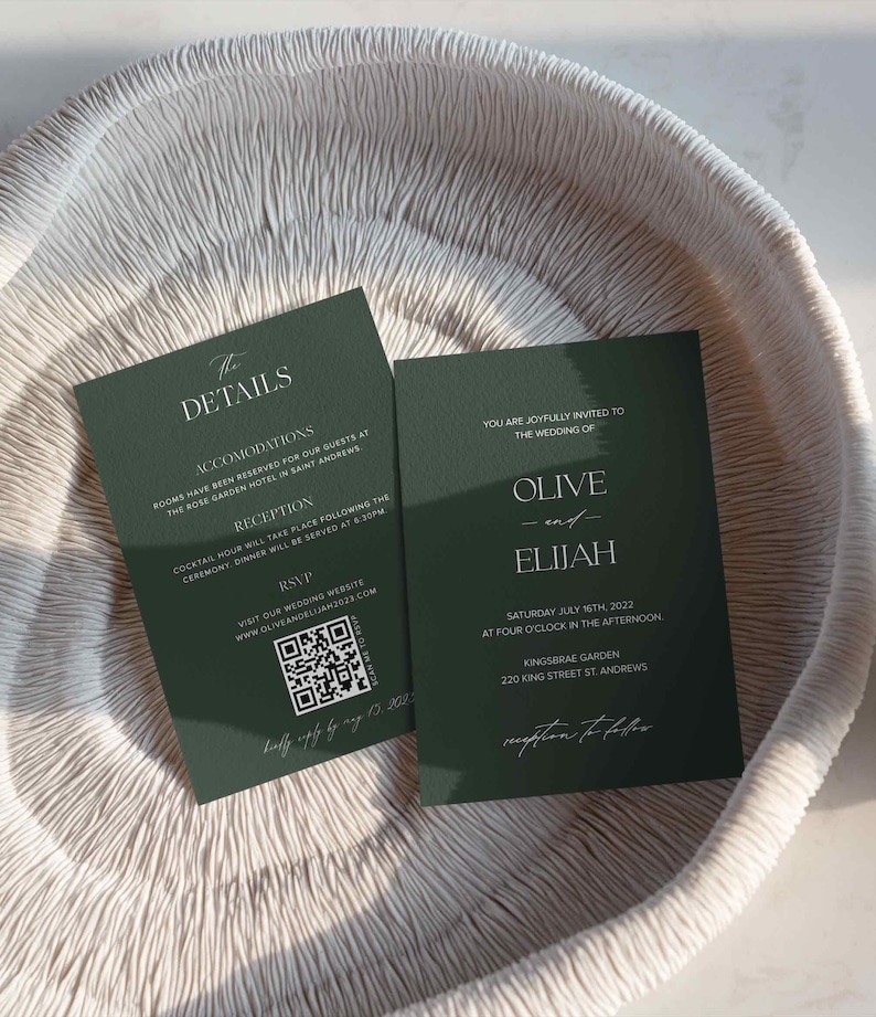 May include: Two green wedding invitation cards with white text. The top card has the details of the wedding, including the date, time, and location. The bottom card has the names of the couple, Olive and Elijah, and the text "You are joyfully invited to the wedding of".