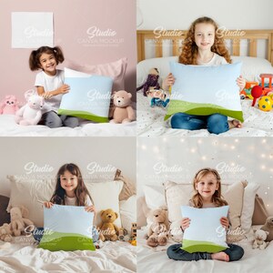 May include: Four children are sitting on beds holding light blue throw pillows with a green and white landscape design. The pillows are on a white bed with a variety of stuffed animals.