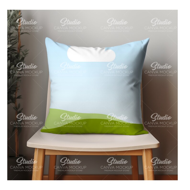 May include: A light blue throw pillow with a white cloud and green hills design. The pillow is sitting on a wooden chair.