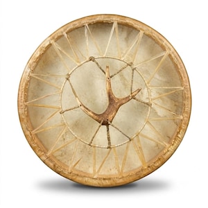 May include: A circular frame drum with a light-colored, translucent animal hide head stretched over a wooden hoop. The drum features a complex lacing system of thin strips securing the hide, with a brown, Y-shaped deer antler centered.