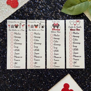 May include: Four white rectangular checklists with black text and red checkboxes. Two cards read Conquering the World One Drink at a Time, one reads Ellie's 21st Birthday World Tour, and one reads Chris & Sami's World Tour, all listing countries.