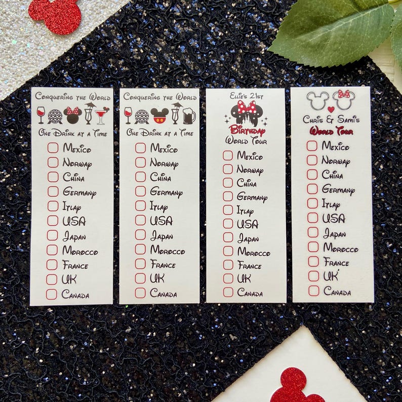 May include: Four white rectangular checklists with black text and red checkboxes. Two cards read Conquering the World One Drink at a Time, one reads Ellie's 21st Birthday World Tour, and one reads Chris & Sami's World Tour, all listing countries.
