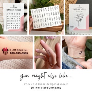 May include: Assortment of temporary tattoos, including alphabet letters, floral designs, and small graphics. One tattoo features a Minnie Mouse design with contact information. Other designs include a cross, paw prints, and a bouquet.