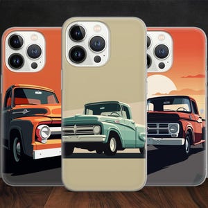 May include: Phone cases with illustrations of vintage trucks in orange, teal, and red. The cases depict classic pickup trucks with a retro style. The designs include a sunset backdrop and a neutral background.
