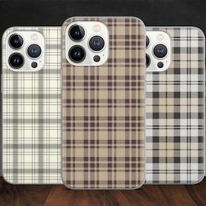 May include: Three mobile phone cases with plaid designs in cream, brown, and black. The cases have a glossy finish and a camera lens cutout. The plaid patterns vary in colour and style.
