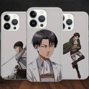 May include: Three clear phone cases featuring different images of characters from the anime Attack on Titan. The cases are designed for an iPhone. The first case shows a character with a sword, the second case shows a character wearing a white coat, and the third case shows a character wearing a green cloak.