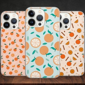 May include: Three clear phone cases with different orange and white fruit designs. The cases are for an iPhone with a camera bump.