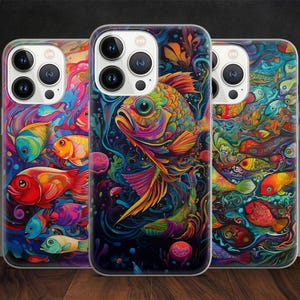 May include: Three phone cases with vibrant, colorful fish designs. The cases feature a variety of fish in shades of red, orange, yellow, blue, and green, set against a dark background. The artwork has a psychedelic, artistic style.