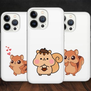 May include: Three white iPhone cases with different cute cartoon squirrel designs. The first case has a squirrel with hearts above its head. The second case has a squirrel holding an acorn. The third case has a squirrel with its paws together.