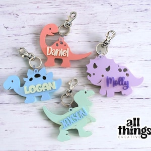Chaveiro de acrílico personalizado de dinossauro: mochila, bolsa de fraldas