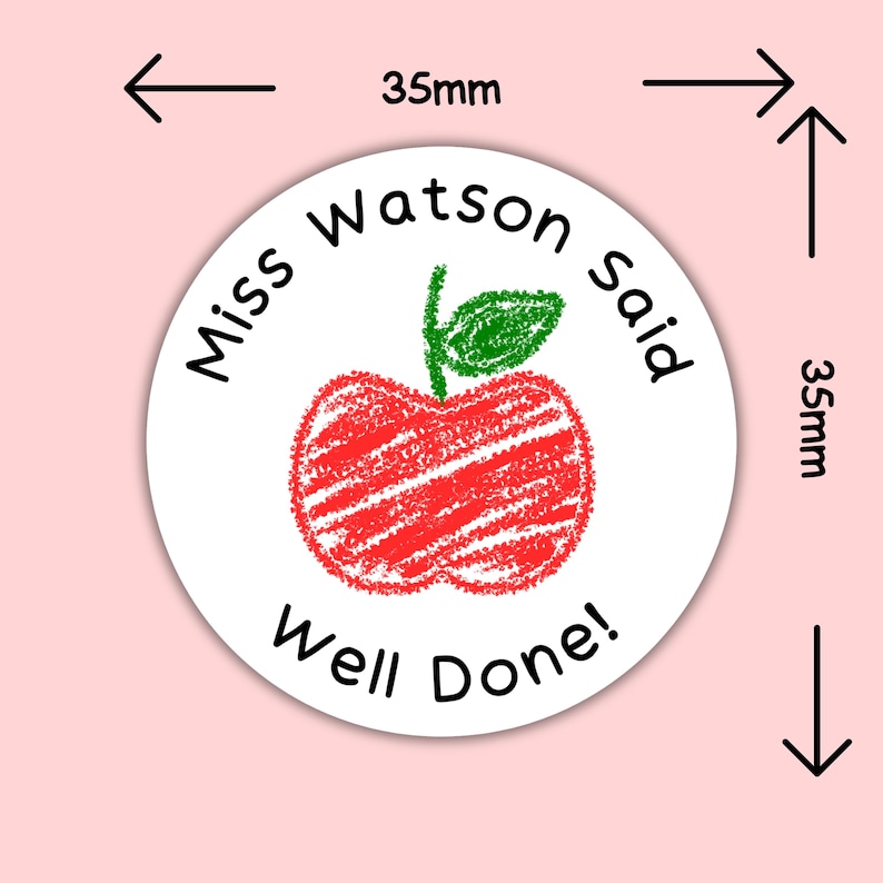 May include: A white round sticker, 35mm in diameter, featuring a red apple illustration with a green leaf. The text "Miss Watson said" and "Well Done!" are printed in black around the apple.
