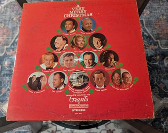 May include: A vintage Christmas album cover with a red background and a Christmas tree design. The album features portraits of various artists and the text "A Very Merry Christmas". The album is a stereo recording.