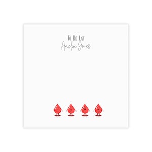 May include: White to-do list notepad with the text "To Do List Amelia Jones" at the top. Four red cartoon blood drops with smiling faces are at the bottom of the notepad.