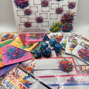 May include: A board game set with the text "COLOR Me Rich!" features colorful paint splatter designs. The set includes cards, dice, and a game board with blank spaces. The dice are blue with white numbers.