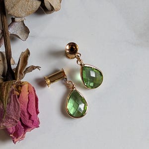 Peridot crystal dangle plugs dangle gauges.  Birthstone