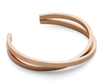 Pink gold plated crossover bangle bracelet in stainless steel. Handmade, adjustable cuff | Unisex