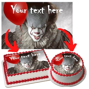 May include: A red balloon with the text "Your text here" floats above a scary clown with a white face, red lips, and black eyes. The clown is wearing a black and white costume. The image is suitable for a cake topper or edible image.