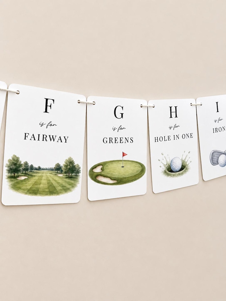 May include: A decorative banner featuring white rectangular cards strung together. Each card displays a letter of the alphabet, the phrase 'is for', and a golf-themed word with a corresponding watercolour illustration, including F for FAIRWAY, G for GREENS, H for HOLE IN ONE, and I for IRON.