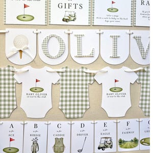 May include: A golf-themed baby shower collection featuring arched signs, a banner spelling OLIVER, onesie-shaped cards, and alphabet cards. Each item displays green gingham patterns, golf illustrations, and text including Baby Oliver is new to the club.
