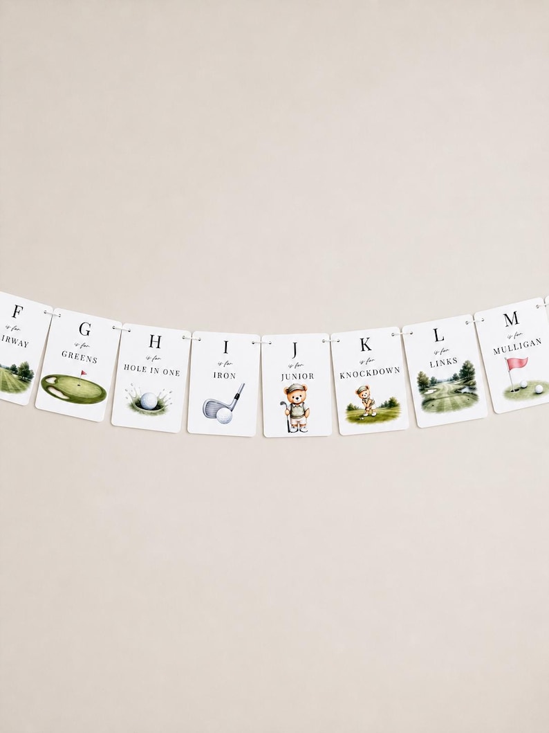 May include: A decorative banner featuring a series of white rectangular cards, each displaying a letter from F to M, golf-themed illustrations, and text including 'F is for Fairway', 'G is for Greens', 'H is for Hole in One', 'I is for Iron', 'J is for Junior', 'K is for Knockdown', 'L is for Links', and 'M is for Mulligan'.