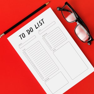 May include: A white To Do List notepad with black text, a black pencil, and black-framed glasses on a red background. The notepad includes sections for date, priorities, notes, and reminders.