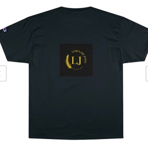 May include: Black t-shirt featuring a gold logo that reads "Lemonade Jones" with a feather and the initials "LJ" within a circle.