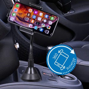 May include: A black car phone holder with a flexible gooseneck arm and a phone mounted on top. The phone displays a colorful app screen. The base of the holder fits into a car's cup holder. A blue circle indicates 360-degree rotation.