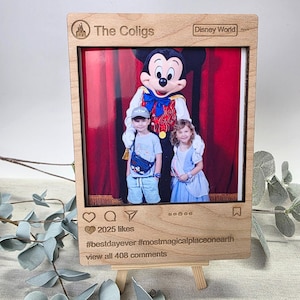 May include: Wooden photo frame with a picture of Mickey Mouse and two children. The frame is designed to look like an Instagram post, with the text "The Coligs" and "Disney World" at the top. The frame also includes the text "#bestdayever #mostmagicalplaceonearth".