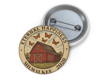 May include: A round button with a graphic of a red barn, butterflies, and the words "Eternal Happiness Milwaukee 2026." The button has a metal pin back and a white border.