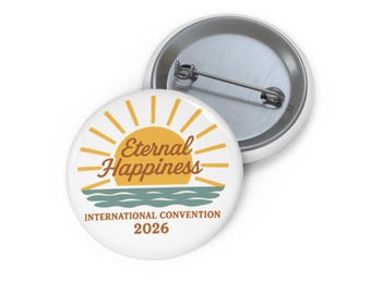 May include: White button pin with the text "Eternal Happiness" in brown script, a yellow sunburst design, and blue water. The text "INTERNATIONAL CONVENTION 2026" is below the image. A second pin is visible in the background.