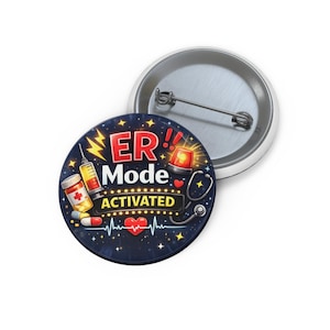 May include: A round button with a medical theme. The button features the text "ER Mode Activated" with illustrations of a syringe, pills, a stethoscope, and a flashing emergency light, all set against a dark blue background with stars.