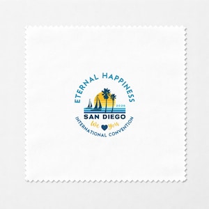 May include: White microfiber cleaning cloth with a printed logo. The logo features a sunset, sailboats, and palm trees, with the text "Eternal Happiness" and "San Diego International Convention 2026".