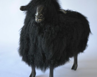 Large BLACK sheep chair with head SLIGHTLY TURNED to the side  made of natural Mongolian llama fur in the style of the famous Lalanne sheep