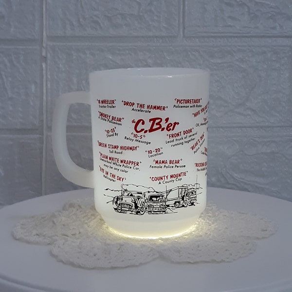 Vintage 1970s white coffee mug with CB Slag and Pictures of a Semi Truck, Van and Car.