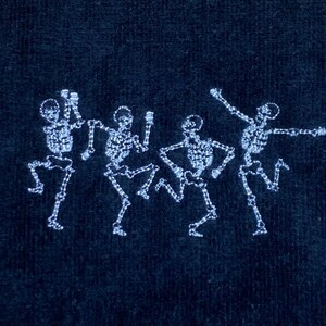 Dancing Skeletons embroidered black golf towel