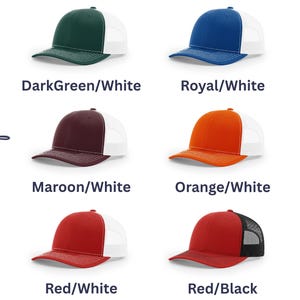 May include: Six baseball caps with curved brims and mesh backs, arranged in two columns. The color combinations are DarkGreen/White, Royal/White, Maroon/White, Orange/White, Red/White, and Red/Black. The text Choice of color is written vertically.