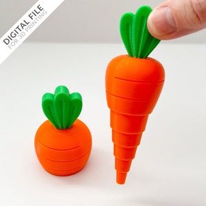 May include: Two 3D printed carrots, one large and one small, with green tops. The carrots are orange and have a textured surface.