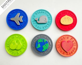 May include: Six colorful round tokens with different designs and messages. The tokens feature a plane, a whale, a dumpling, a pear, a globe, and a heart. The messages on the tokens include "You're Just Awesome!", "You Be My Valentine Whale", "You're All That And Dim Sum", "Together We Make A Great Pear", "You're Out Of This World!" and "Happy Valentine's Day!"