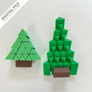 Puede incluir: Dos árboles de Navidad verdes hechos de triángulos, uno es más alto que el otro. Ambos árboles tienen una base marrón.