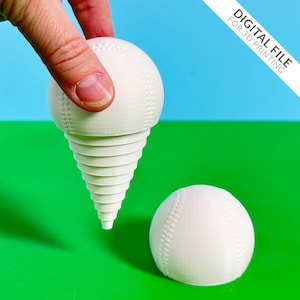 May include: A white 3D-printed baseball-themed object, with a baseball top and a spiraling cone base. Another baseball is also present. The background is green and blue. The text "DIGITAL FILE FOR 3D PRINTING" is visible.