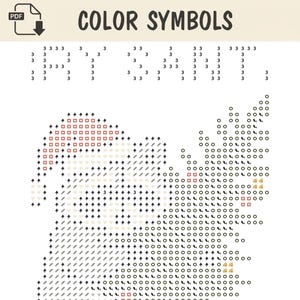 May include: A cross-stitch pattern chart titled COLOR SYMBOLS featuring a grid of numbers and icons. The design depicts a Santa Claus figure with a hat and beard, alongside a pine tree, using various symbols like squares, circles, and arrows.