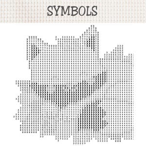 May include: A cross-stitch pattern chart on a white fabric background with the word SYMBOLS printed at the top. The design consists of a dense grid of black numbers and crescent moon icons arranged to form a large, complex leaf-like shape.
