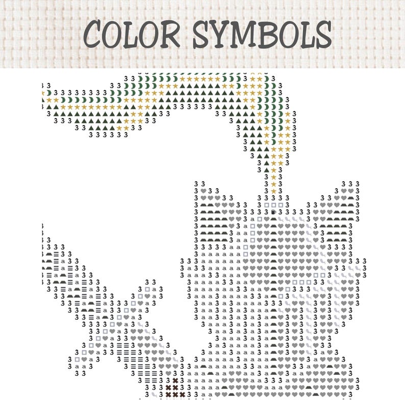 Op de afbeelding: Een kruissteekpatroon met de titel COLOR SYMBOLS in een rasterindeling. Het ontwerp toont een katachtige silhouet samengesteld uit diverse alfanumerieke tekens, cijfers en geometrische symbolen, waaronder sterren, manen, hartjes en vierkantjes.