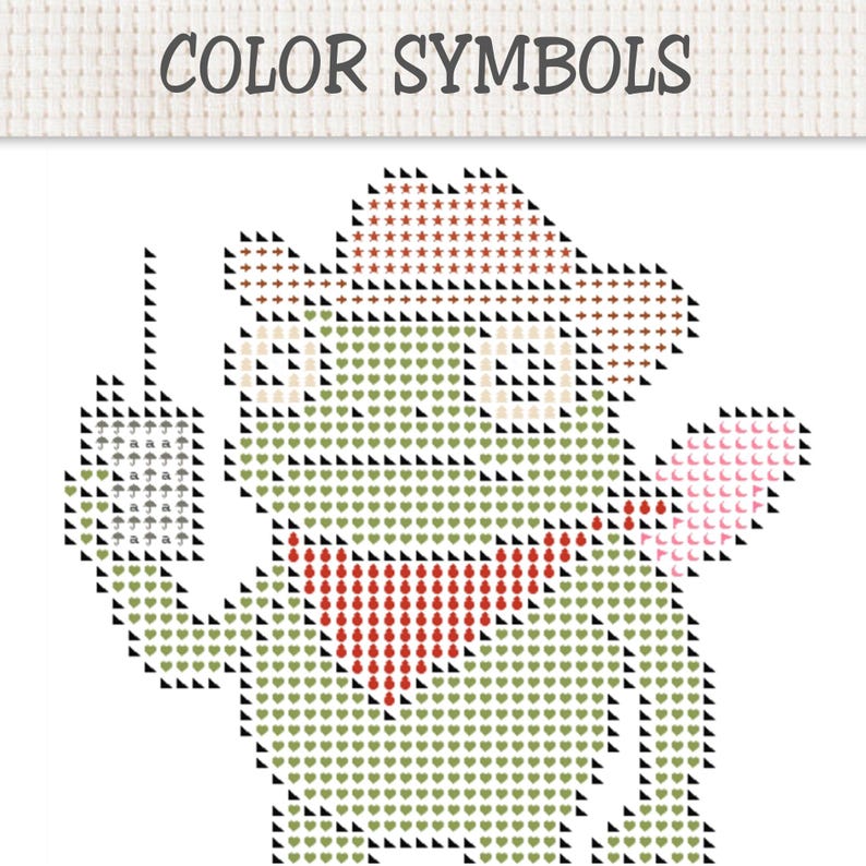 May include: A cross-stitch pattern titled COLOR SYMBOLS featuring a green frog wearing a cowboy hat and a red bandana. The frog holds a small rectangular sign with umbrella icons. The design uses various symbols like hearts and stars.