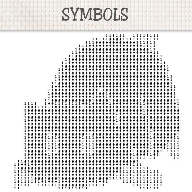 May include: A cross-stitch pattern chart on white fabric with the word SYMBOLS printed at the top. The design features a grid filled with the number 1 and black spade symbols arranged to form a rounded shape against a plain white background.