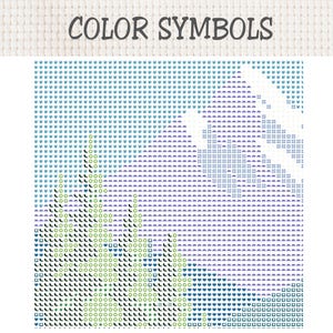 May include: A cross-stitch pattern chart titled COLOR SYMBOLS featuring a grid of symbols on a white fabric background. The design displays a landscape with light blue, purple, and green geometric shapes representing trees and mountains.