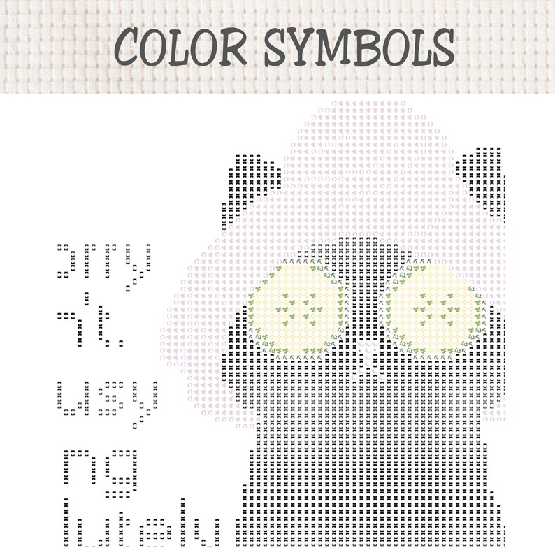 May include: A cross-stitch pattern chart titled COLOR SYMBOLS featuring a grid layout with black, grey, and light green symbols. The design depicts a stylised animal figure with large eyes, using various alphanumeric characters and shapes.