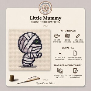 May include: A Little Mummy cross stitch pattern featuring a stitched mummy character on beige fabric. The digital file includes 30 x 44 stitches, 5 DMC colors, and measures 2.1 x 3.1 inches on 14 ct Aida. Includes a thimble and needle tool.