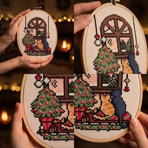K&ouml;nnte beinhalten: Eine Kreuzstichstickerei in einem runden Holzrahmen mit einer weihnachtlichen Szene, die einen geschm&uuml;ckten Weihnachtsbaum, einen Fensterblick auf eine verschneite Landschaft und zwei zusammensitzende Katzen zeigt. Das Design enth&auml;lt rote, gr&uuml;ne, blaue und orangefarbene F&auml;den.