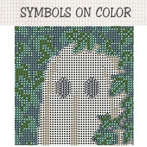 May include: A cross stitch pattern chart titled SYMBOLS ON COLOR featuring a grid of geometric symbols. The design displays a central white ghost-like figure composed of black triangles and circles against a dark green background of squares.